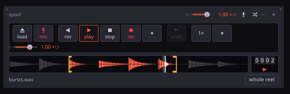 Spool’s deck: load and mic keys, the tape transport, rec and undo, the speed key, and the reel with its two loop markers.